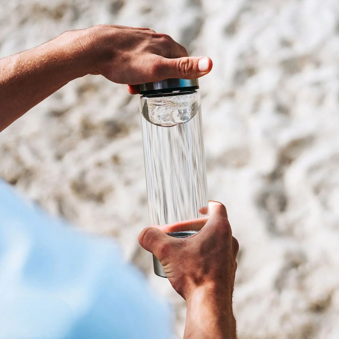 Hydromi - Health in a Bottle with hydration benefits. Sleek transparent design with stainless steel accents, enhancing water quality for better wellness.